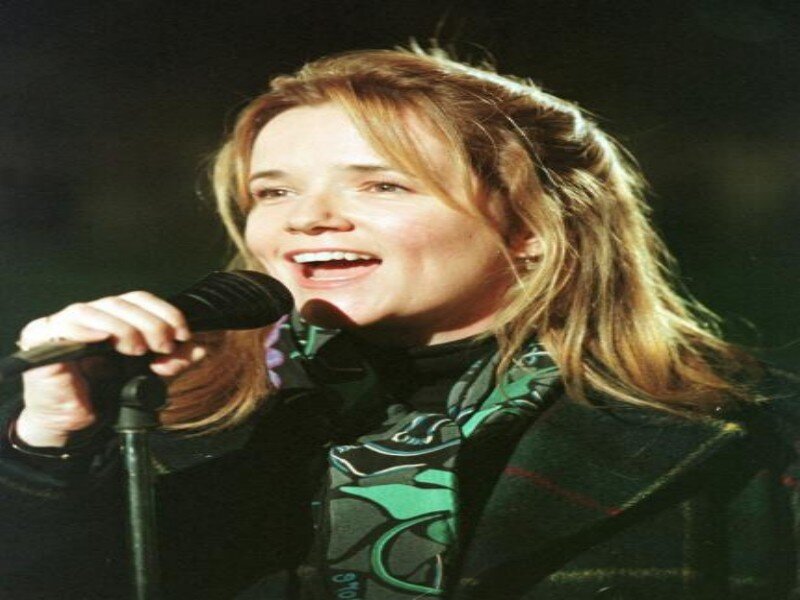 Woman Singing into Microphone — Green, Energetic