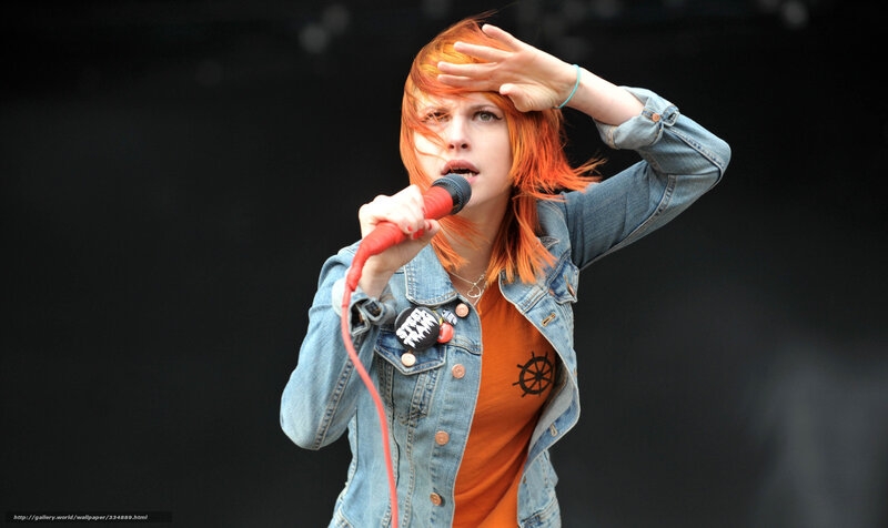 Woman Singing into Microphone — Orange, Energetic, Afternoon