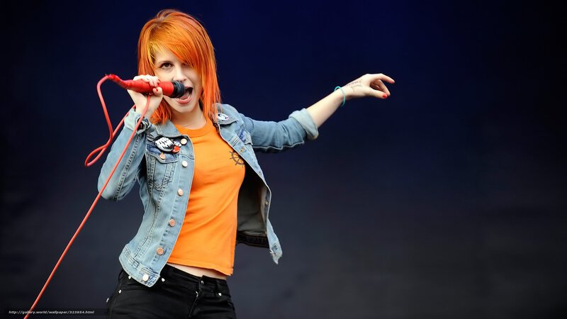 Woman Singing into Microphone — Orange, Energetic, Photograph