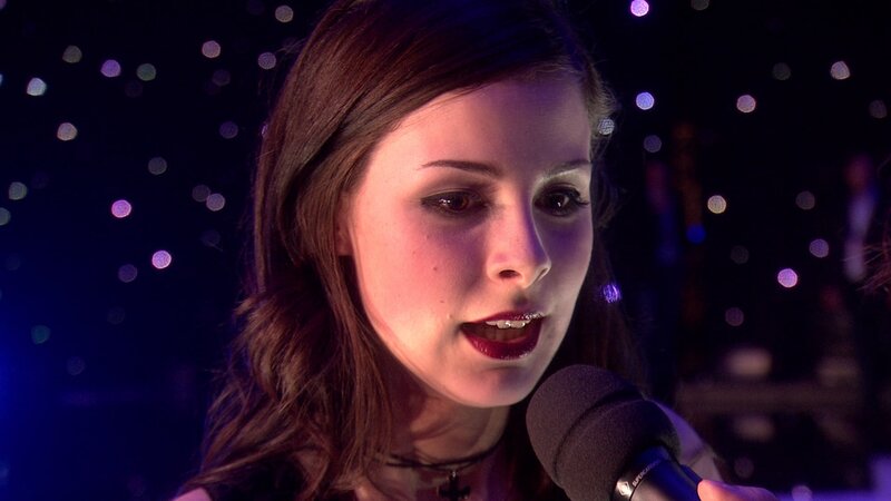 Woman Singing into Microphone — Purple, Dramatic, Night, Photograph