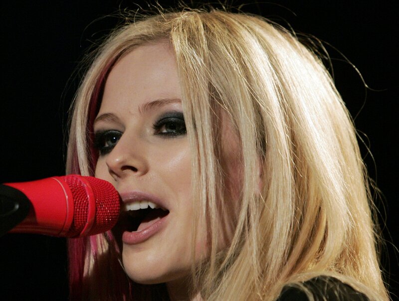 Woman Singing into Microphone — Red, Dramatic, Photograph, Blonde Hair