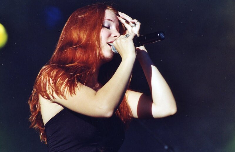 Woman Singing into Microphone — Red, Dramatic