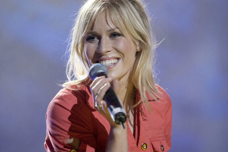 Woman Singing into Microphone — Red, Lively, Photograph, Red Shirt