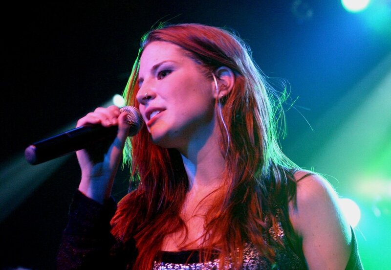 Woman Singing into Microphone — Red