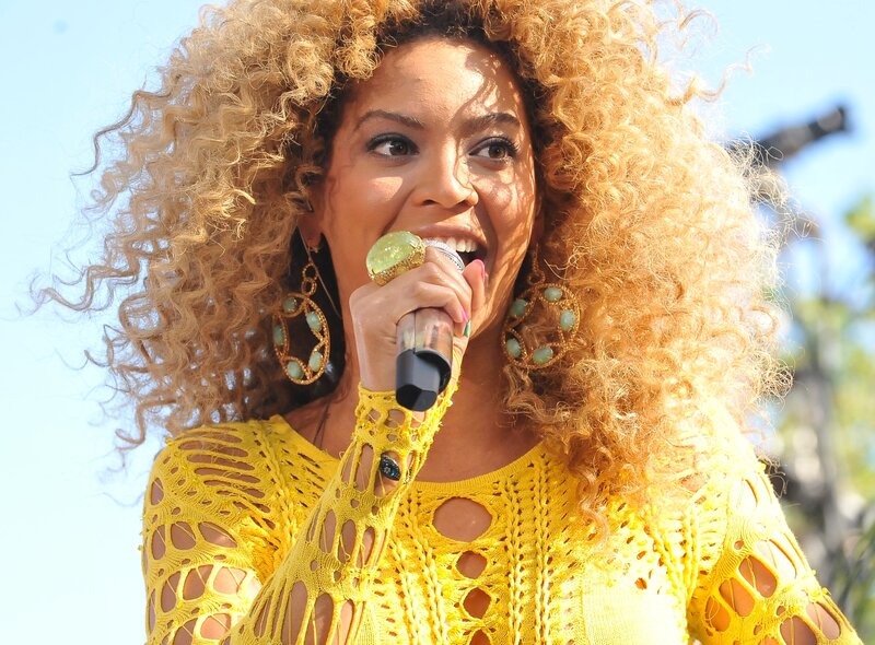 Woman Singing into Microphone — Yellow