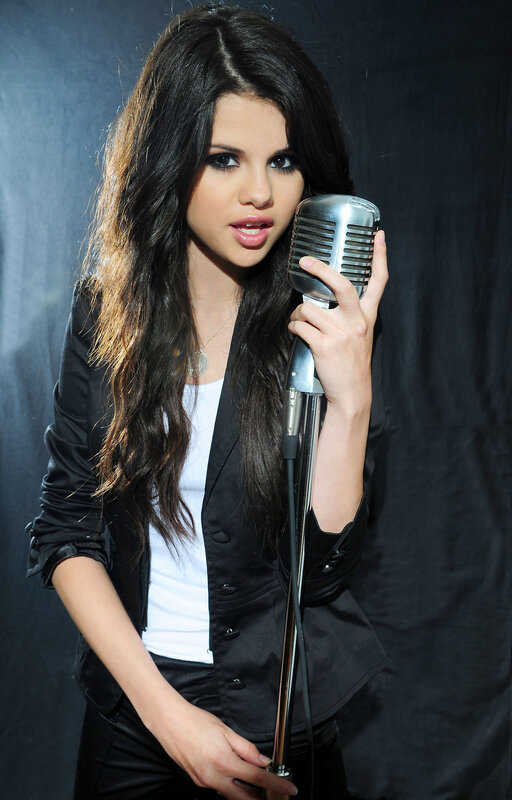 woman singing into vintage microphone