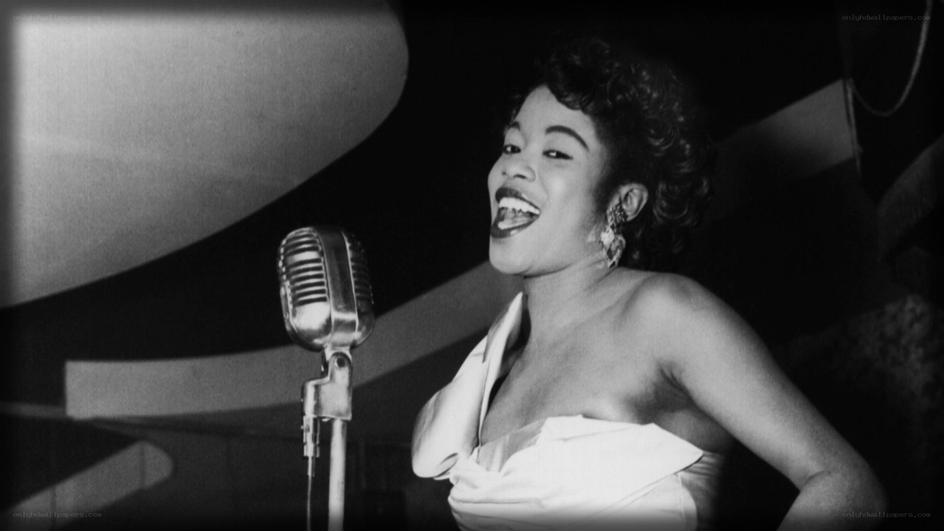woman singing into vintage microphone