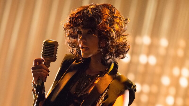 woman singing into vintage microphone