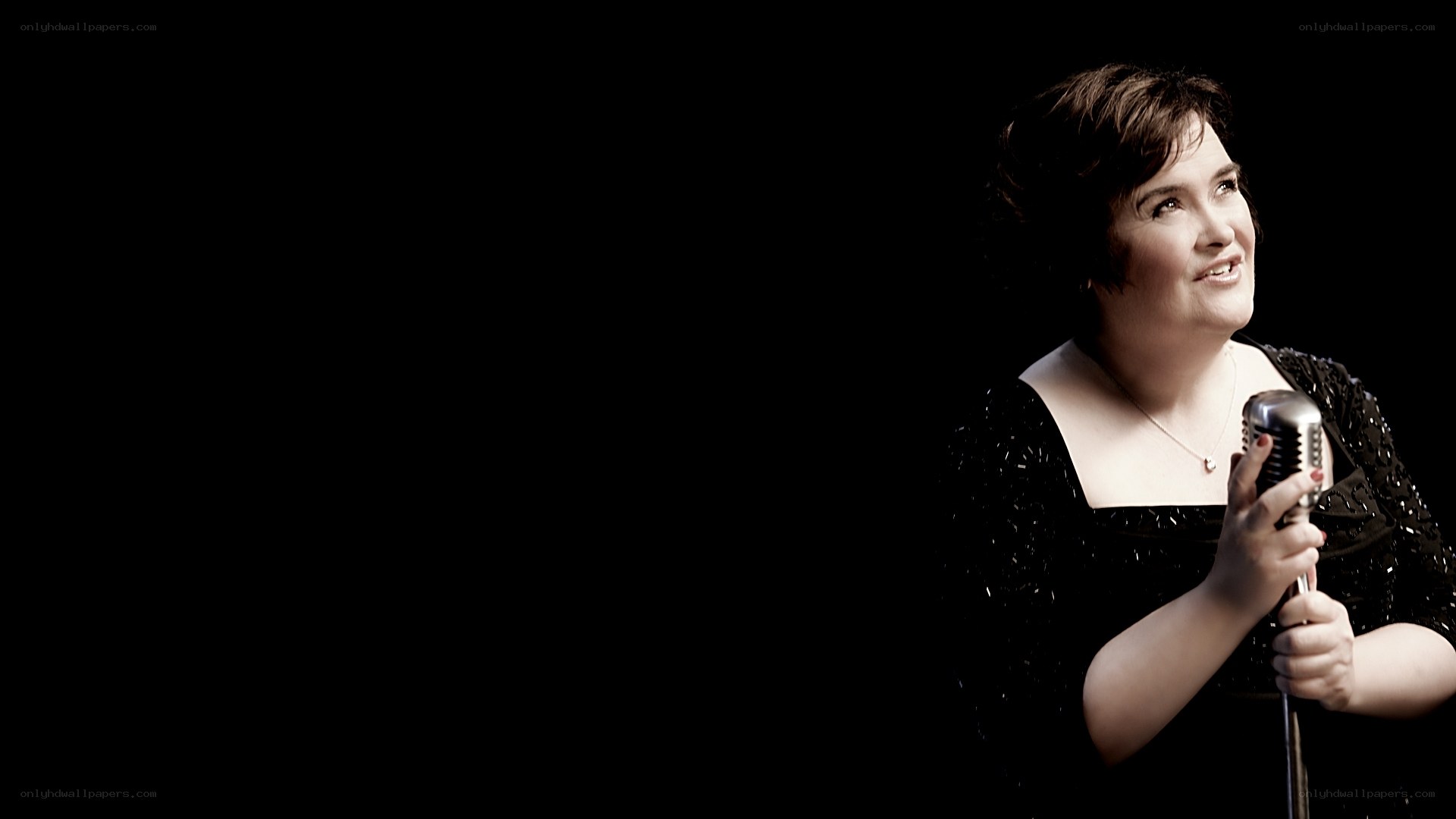 woman singing into vintage microphone