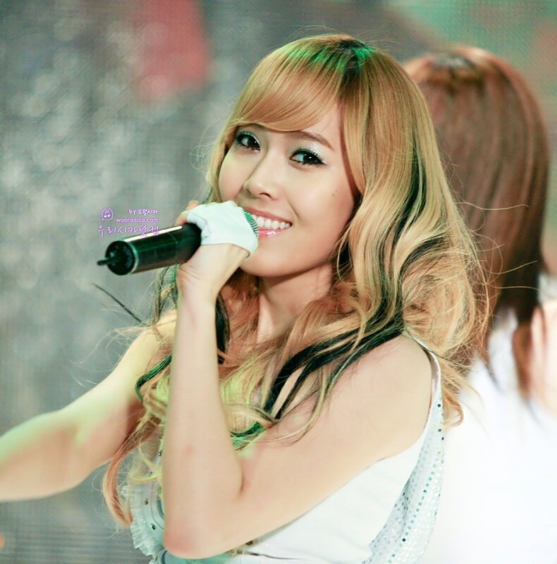 woman singing on stage