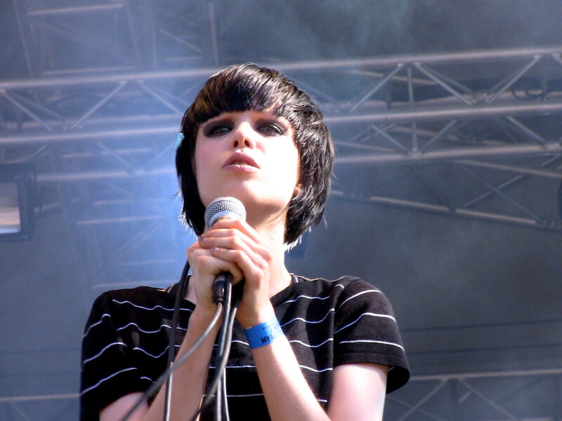 woman singing on stage