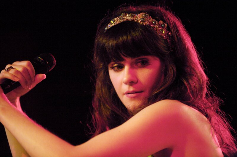 woman singing on stage