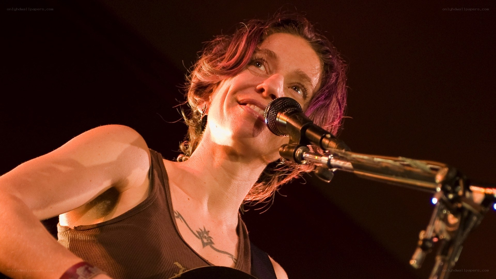 woman singing on stage