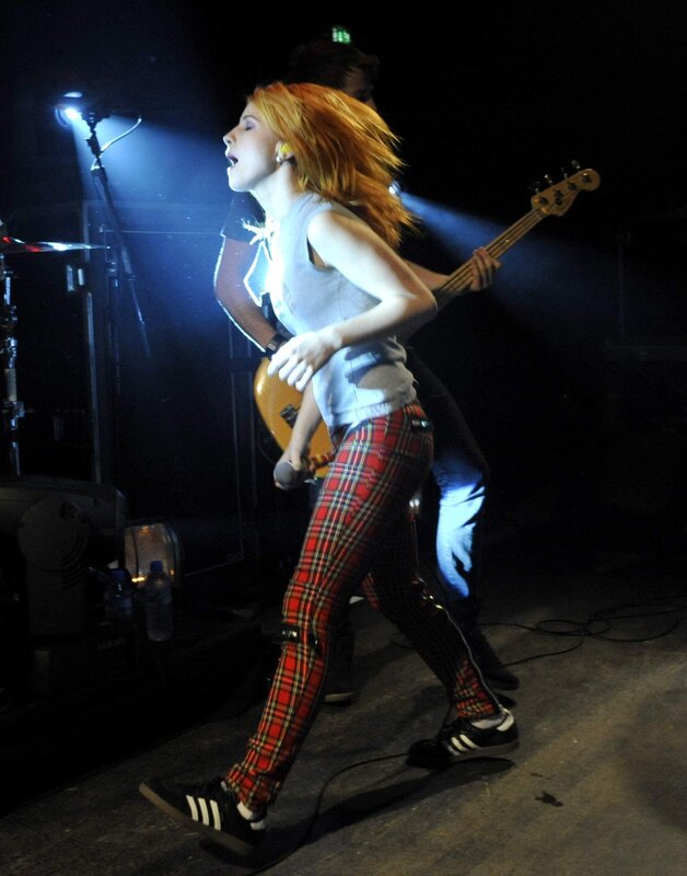 woman singing on stage