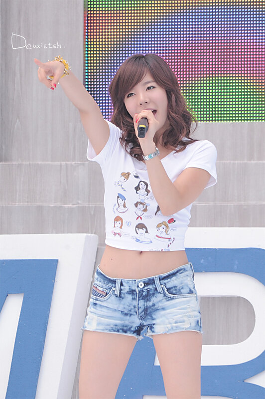 woman singing on stage