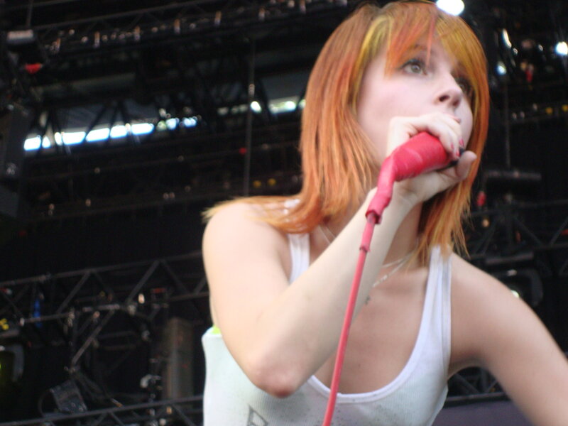 woman singing on stage