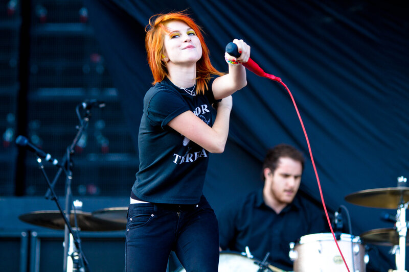 woman singing on stage
