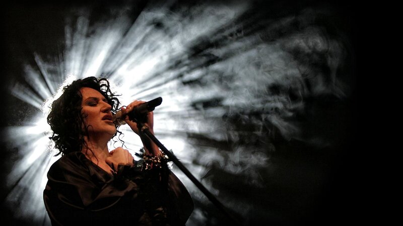 woman singing on stage