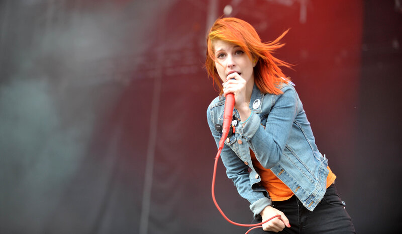 woman singing on stage