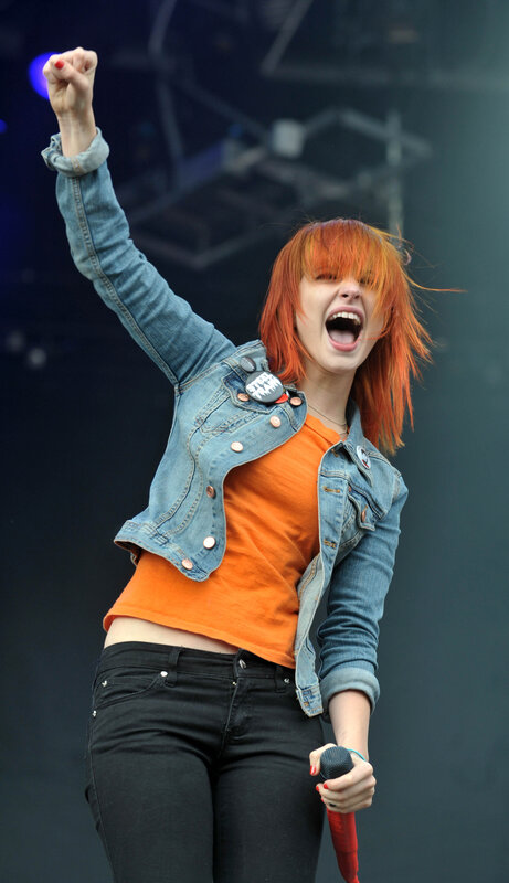 woman singing on stage