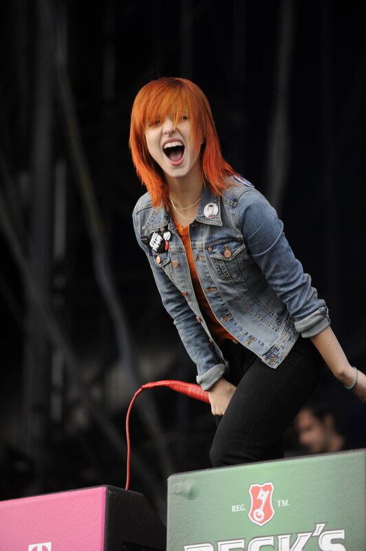 woman singing on stage