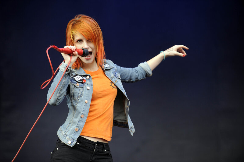 woman singing on stage