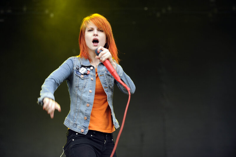 woman singing on stage