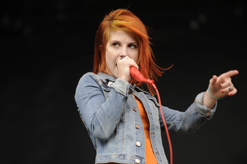 woman singing on stage