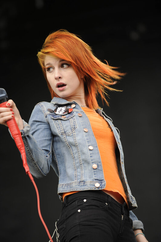 woman singing on stage