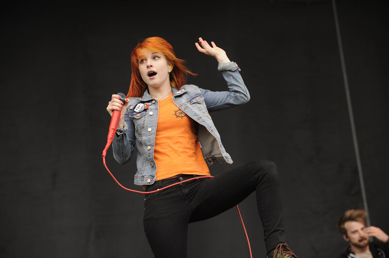 woman singing on stage