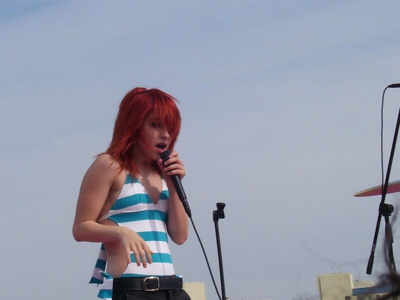 woman singing on stage