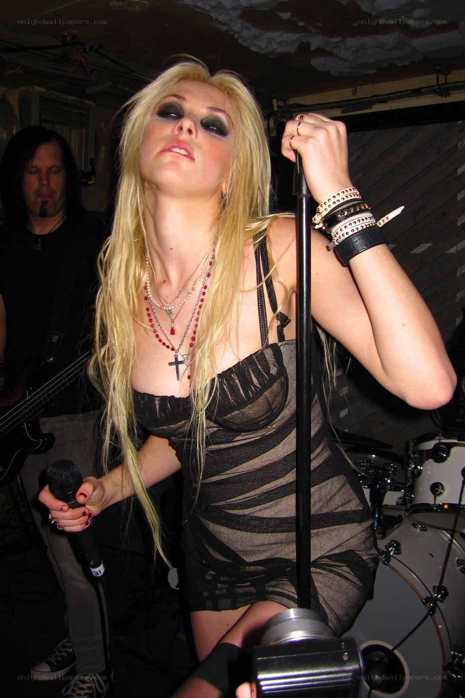 woman singing on stage