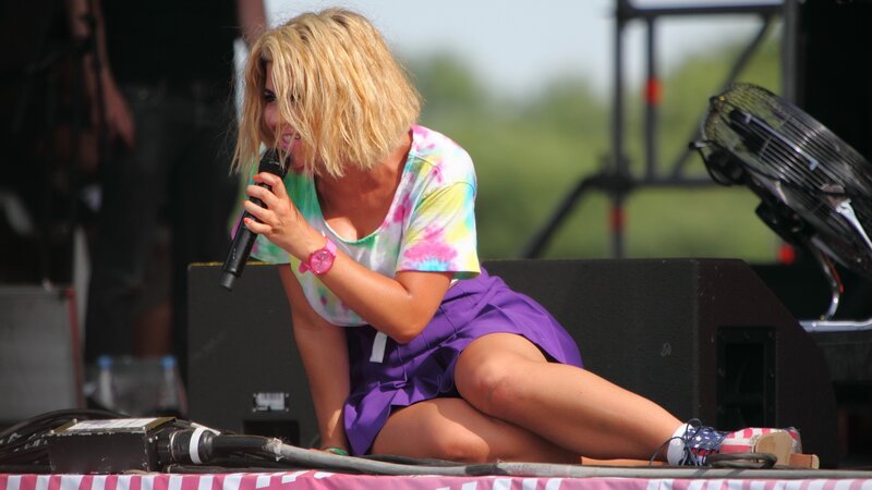 woman singing on stage