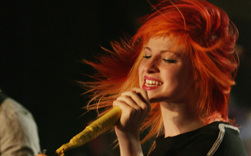 woman singing on stage