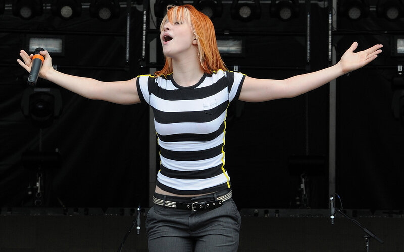 woman singing on stage