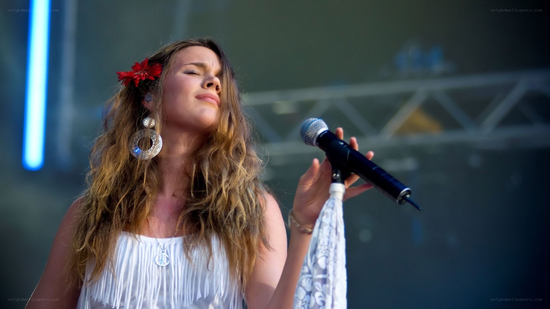 woman singing on stage
