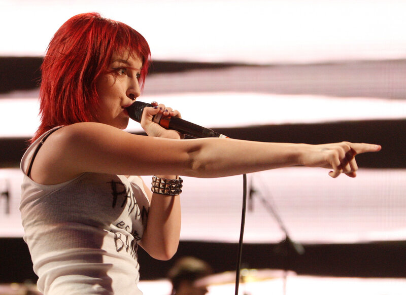 woman singing on stage