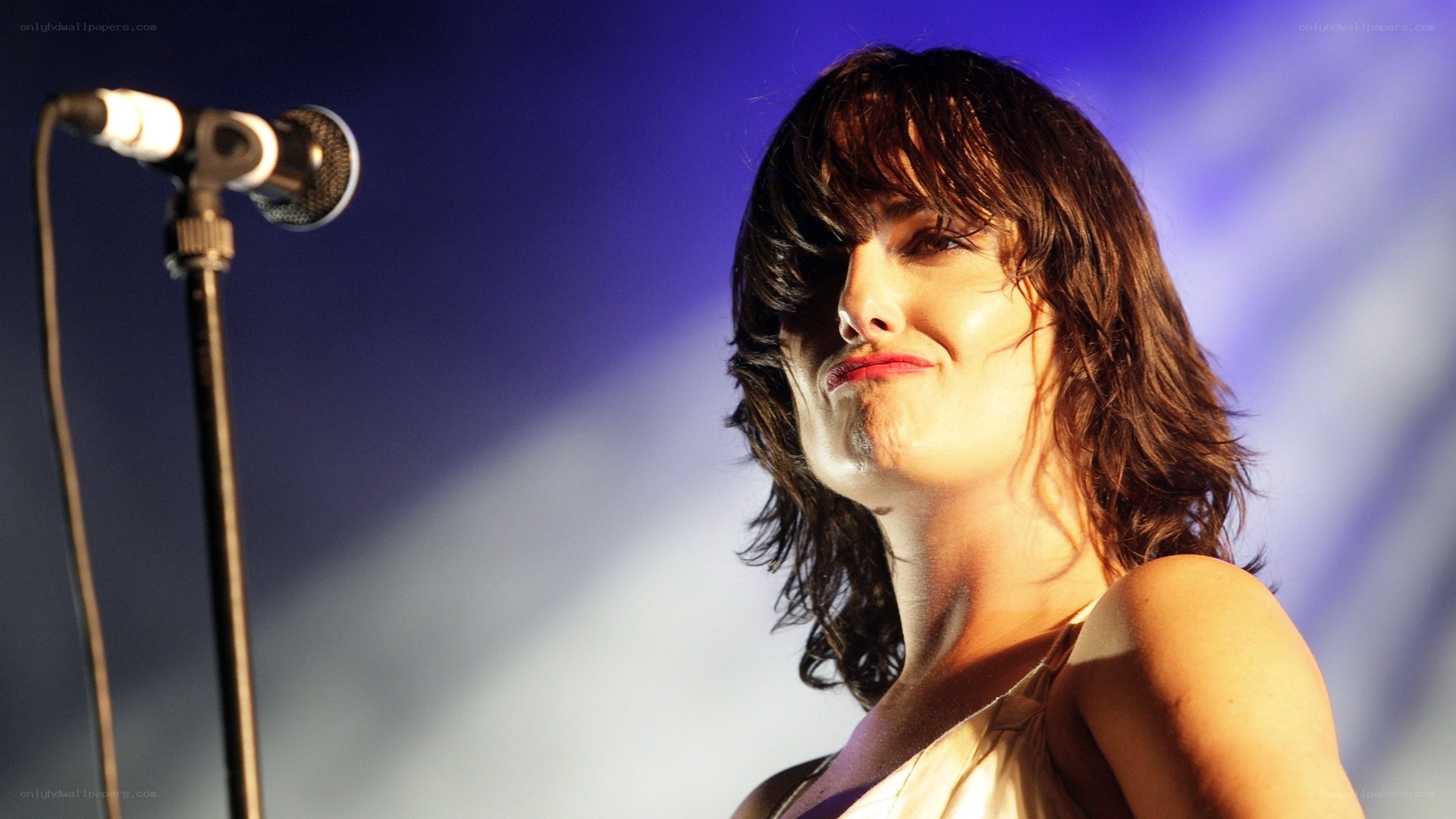 woman singing on stage