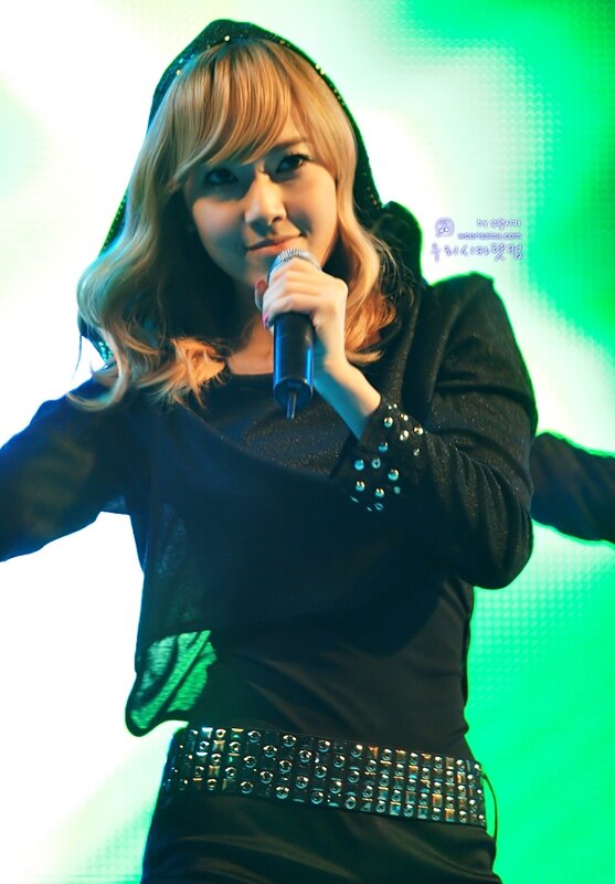 woman singing on stage