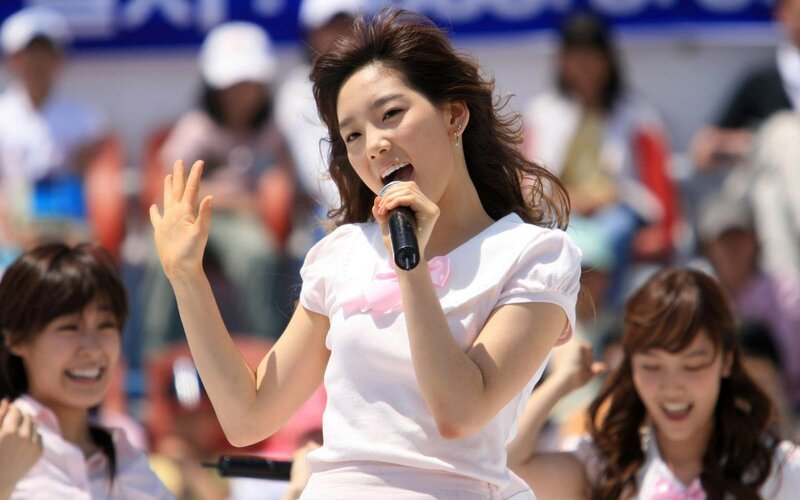 woman singing on stage