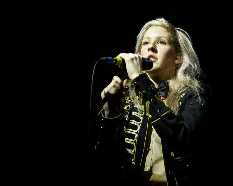 woman singing on stage