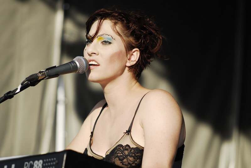 woman singing on stage