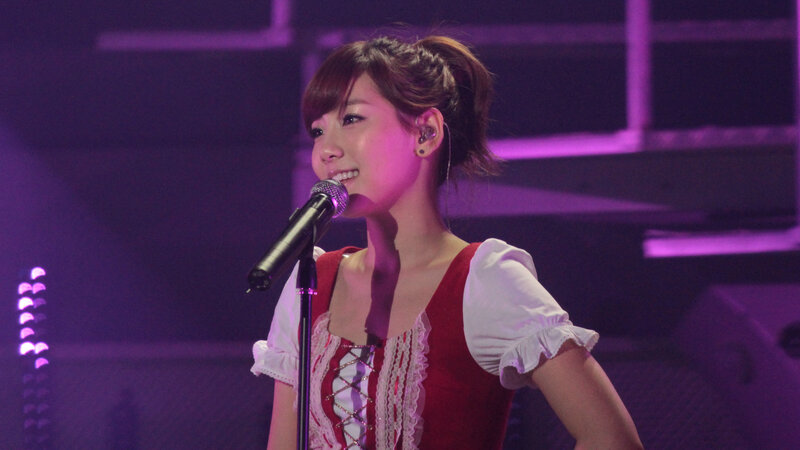 woman singing on stage