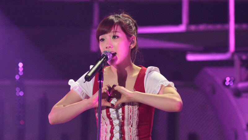 woman singing on stage