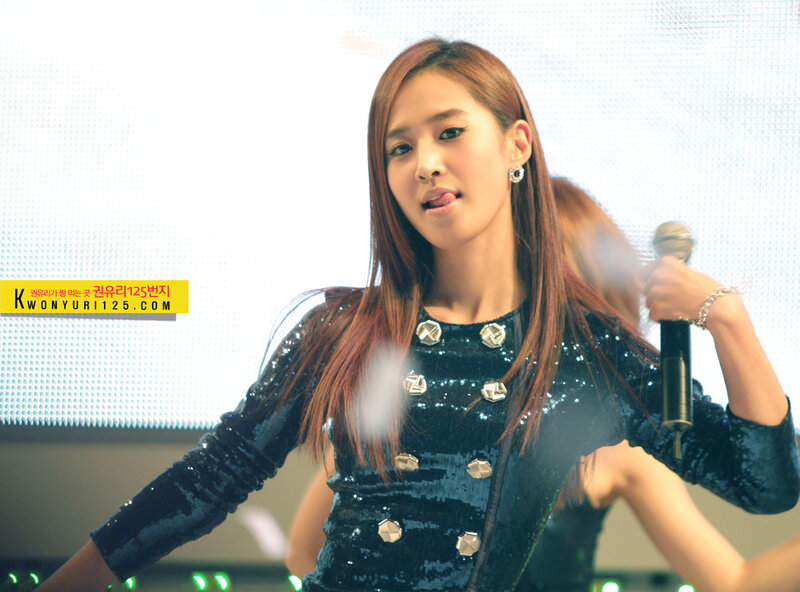 woman singing on stage