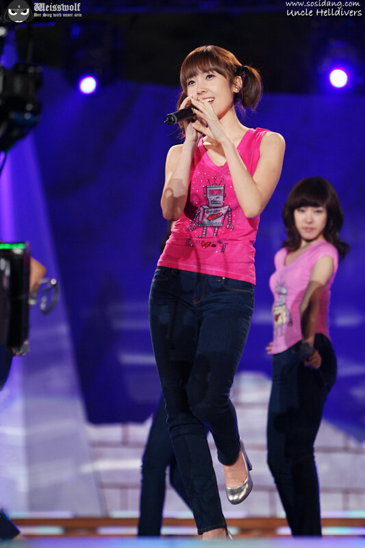 woman singing on stage