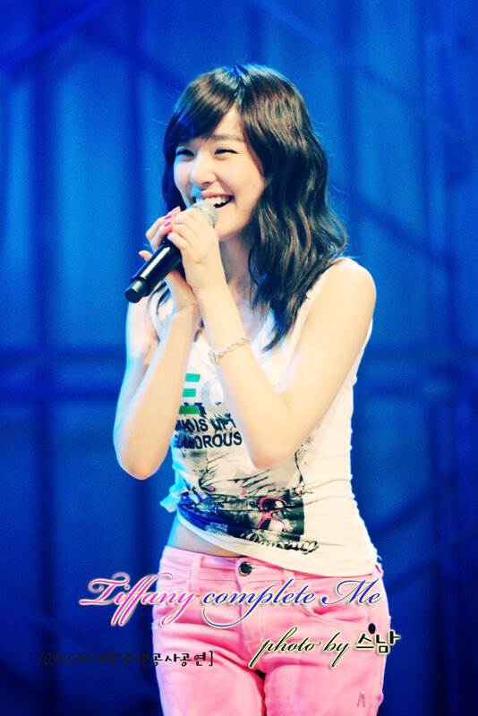 woman singing on stage