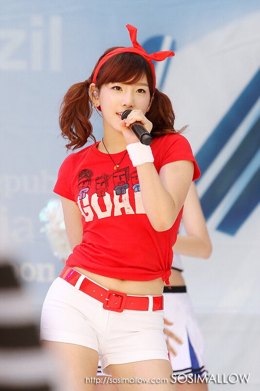 woman singing on stage
