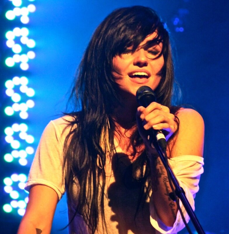 woman singing on stage