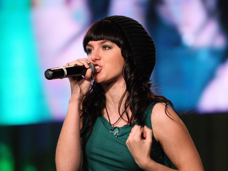 woman singing on stage